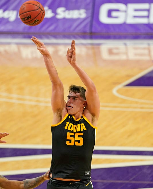 Jan 17, 2021; Evanston, Illinois, USA; Iowa Hawkeyes center Luka Garza (55) shoots the ball against the Northwestern Wildcats during the first half at Welsh-Ryan Arena.