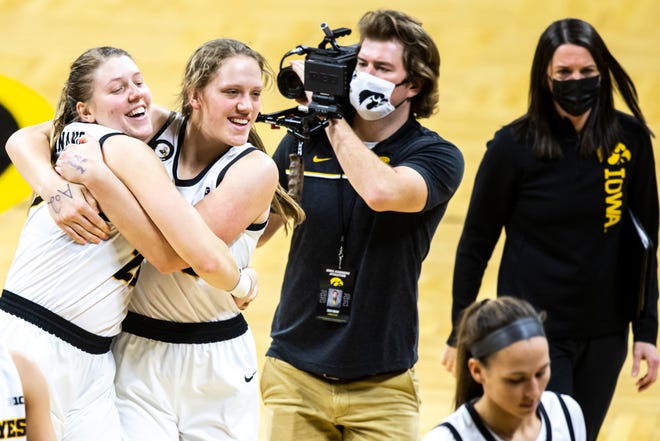 Iowa center Monika Czinano, left, embraces teammate Sharon Goodman after the Hawkeyes beat Purdue during a NCAA Big Ten Conference women's basketball game, Monday, Jan. 18, 2021, at Carver-Hawkeye Arena in Iowa City, Iowa.