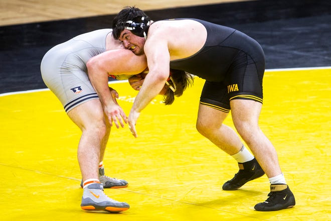 Iowa's Tony Cassioppi wrestles llinois' Luke Luffman at 285 pounds during a NCAA Big Ten Conference wrestling dual, Sunday, Jan. 31, 2021, at Carver-Hawkeye Arena in Iowa City, Iowa.