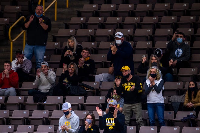 Iowa Hawkeyes fans cheer during a NCAA Big Ten Conference wrestling dual, Sunday, Jan. 31, 2021, at Carver-Hawkeye Arena in Iowa City, Iowa.