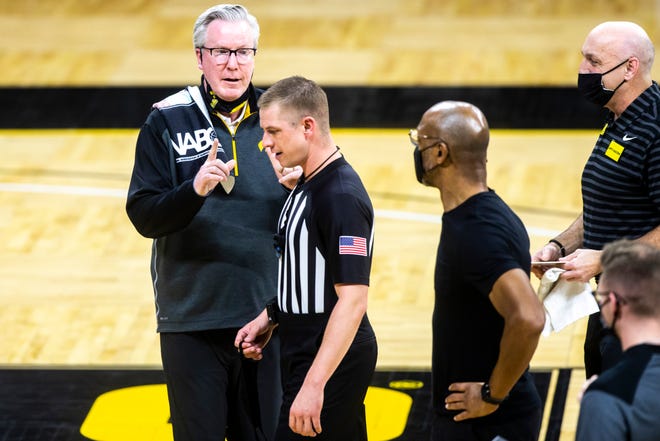 Iowa head coach Fran McCaffery, left, talks with Big Ten official Brooks Wells during a NCAA Big Ten Conference men's basketball game against Penn State, Sunday, Feb. 21, 2021, at Carver-Hawkeye Arena in Iowa City, Iowa.