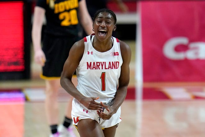 Maryland guard Diamond Miller reacts after scoring a basket against the Iowa during the first half of an NCAA college basketball game, Tuesday, Feb. 23, 2021, in College Park, Md.