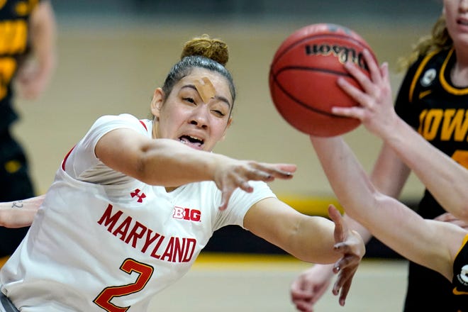 Maryland forward Mimi Collins (2) competes for a rebound against the Iowa during the first half of an NCAA college basketball game, Tuesday, Feb. 23, 2021, in College Park, Md.