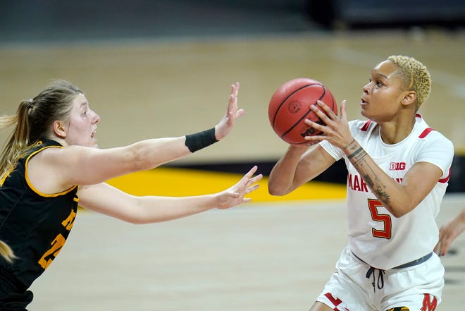 Maryland forward Alaysia Styles (5) shoots against Iowa forward Monika Czinano during the first half of an NCAA college basketball game, Tuesday, Feb. 23, 2021, in College Park, Md.