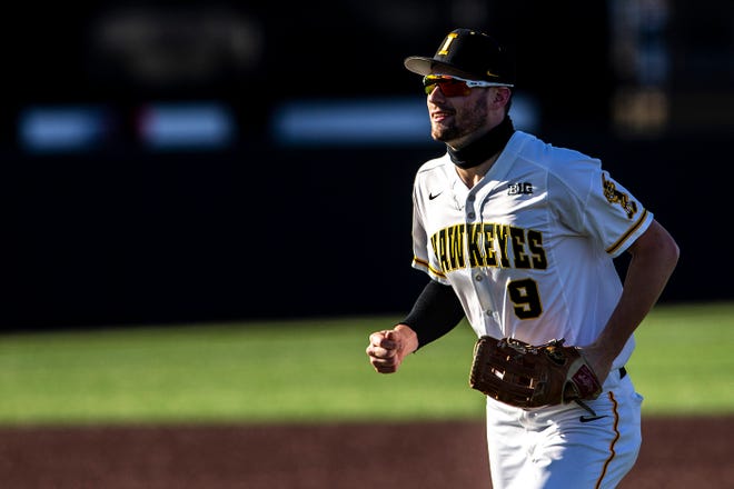 Iowa's Ben Norman runs into the dugout after getting an out in center field during a NCAA Big Ten Conference baseball game against Nebraska, Friday, March 19, 2021, at Duane Banks Field in Iowa City, Iowa.