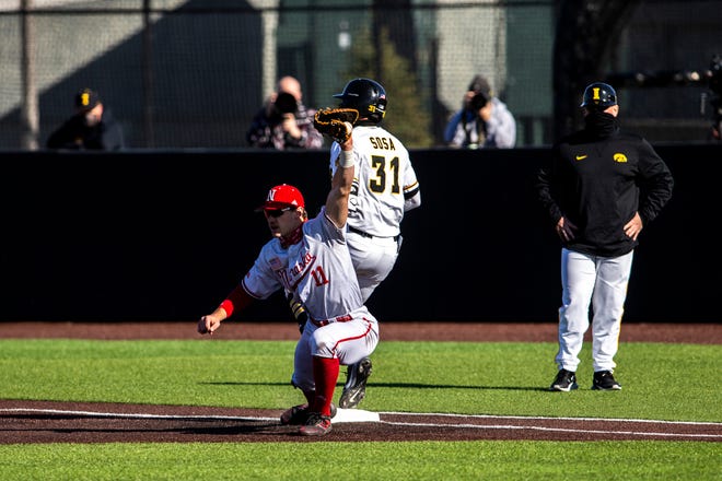 Nebraska's Jack Steil gets an out at first against Iowa's Matthew Sosa during a NCAA Big Ten Conference baseball game against Nebraska, Friday, March 19, 2021, at Duane Banks Field in Iowa City, Iowa.