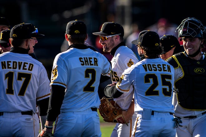 Iowa's Ben Norman gets embraced by teammates after getting an out in center field during a NCAA Big Ten Conference baseball game against Nebraska, Friday, March 19, 2021, at Duane Banks Field in Iowa City, Iowa.