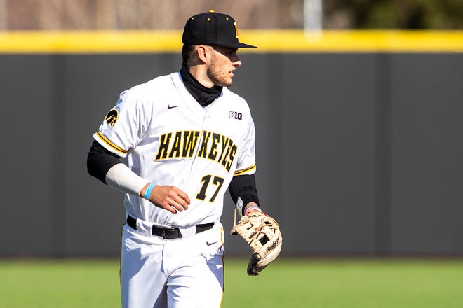 Iowa's Dylan Nedved (17) gets set between innings during a NCAA Big Ten Conference baseball game against Nebraska, Friday, March 19, 2021, at Duane Banks Field in Iowa City, Iowa.
