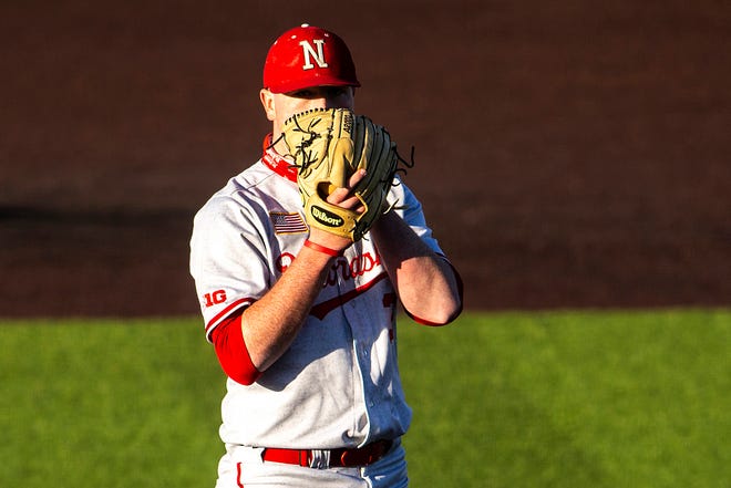 Nebraska pitcher Emmett Olson looks for a signal during a NCAA Big Ten Conference baseball game against Iowa, Friday, March 19, 2021, at Duane Banks Field in Iowa City, Iowa.