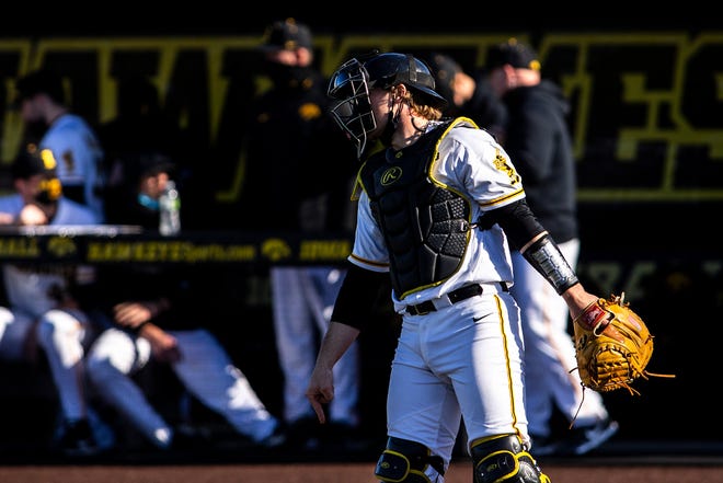 Iowa catcher Austin Martin (34) walks out to the plate during a NCAA Big Ten Conference baseball game against Nebraska, Friday, March 19, 2021, at Duane Banks Field in Iowa City, Iowa.