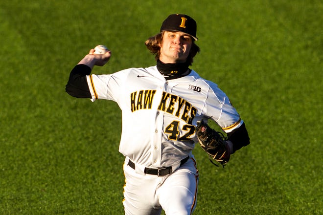Iowa's Trace Hoffman (42) delivers a pitch during a NCAA Big Ten Conference baseball game against Nebraska, Friday, March 19, 2021, at Duane Banks Field in Iowa City, Iowa.