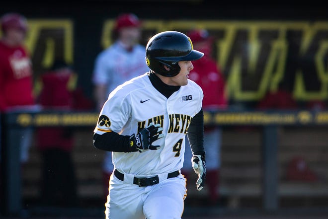 Iowa's Brayden Frazier (4) rounds first base after hitting a double during a NCAA Big Ten Conference baseball game against Nebraska, Friday, March 19, 2021, at Duane Banks Field in Iowa City, Iowa.
