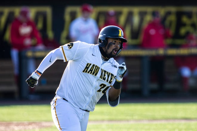 Iowa's Izaya Fullard (20) rounds first base after hitting a double during a NCAA Big Ten Conference baseball game against Nebraska, Friday, March 19, 2021, at Duane Banks Field in Iowa City, Iowa.
