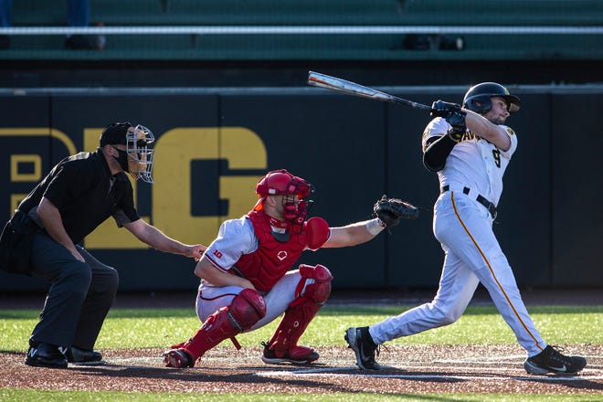 Iowa's Ben Norman (9) hits a home run during a NCAA Big Ten Conference baseball game against Nebraska, Friday, March 19, 2021, at Duane Banks Field in Iowa City, Iowa.