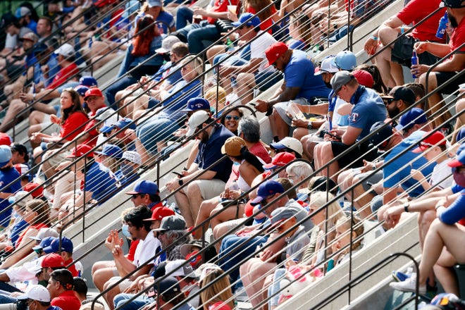 Fans look on as the Rangers take on the Blue Jays.