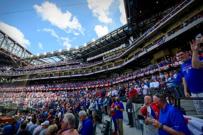 Fans pack Globe Life Field for the Texas Rangers' home opener against the Toronto Blue Jays.