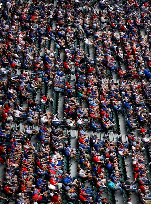 Fans look on as the Rangers take on the Blue Jays in the fourth inning at Globe Life Field.