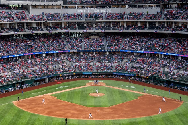 Fans fill the stands at Globe Life Field during the second inning of the game between the Rangers and Blue Jays.