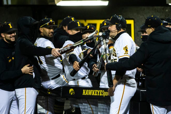 Iowa's Peyton Williams (45) does an interview as teammates listen in after a NCAA Big Ten Conference baseball game against Minnesota, Friday, April 9, 2021, at Duane Banks Field in Iowa City, Iowa.