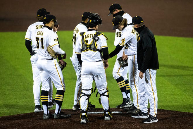 Iowa's Trace Hoffman (42) walks up to the mound as a relief pitcher during a NCAA Big Ten Conference baseball game against Minnesota, Friday, April 9, 2021, at Duane Banks Field in Iowa City, Iowa.