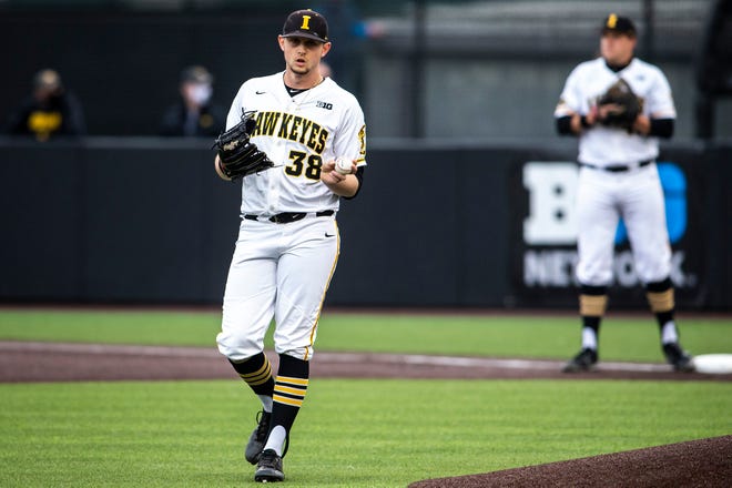 Iowa's Trenton Wallace (38) walks out to the mound before pitching during a NCAA Big Ten Conference baseball game against Minnesota, Friday, April 9, 2021, at Duane Banks Field in Iowa City, Iowa.