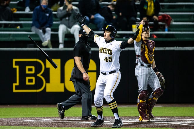 Iowa's Peyton Williams (45) celebrates after hitting a grand slam home run during a NCAA Big Ten Conference baseball game against Minnesota, Friday, April 9, 2021, at Duane Banks Field in Iowa City, Iowa.