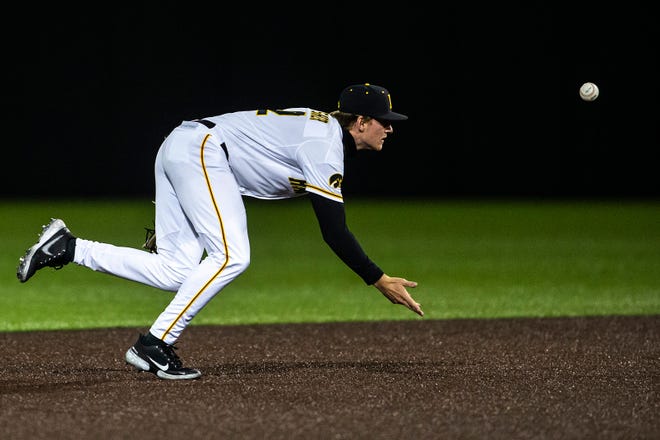 Iowa's Brendan Sher (2) tosses a ball to a teammate for an out during a NCAA Big Ten Conference baseball game against Minnesota, Friday, April 9, 2021, at Duane Banks Field in Iowa City, Iowa.