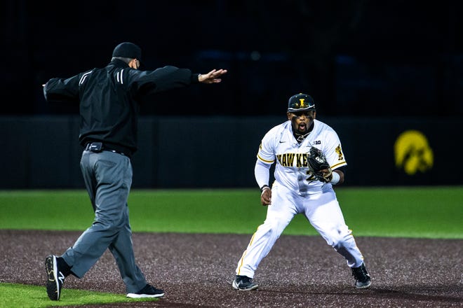Iowa's Izaya Fullard (20) reacts as a runner gets called safe during a NCAA Big Ten Conference baseball game against Minnesota, Friday, April 9, 2021, at Duane Banks Field in Iowa City, Iowa.