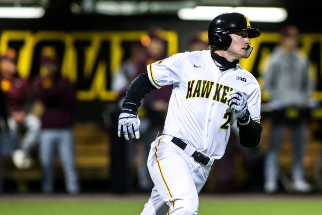 Iowa's Brendan Sher (2) rounds first during a NCAA Big Ten Conference baseball game against Minnesota, Friday, April 9, 2021, at Duane Banks Field in Iowa City, Iowa.