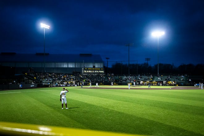 Fans watch as the Iowa Hawkeyes bat during a NCAA Big Ten Conference baseball game against Minnesota, Friday, April 9, 2021, at Duane Banks Field in Iowa City, Iowa.