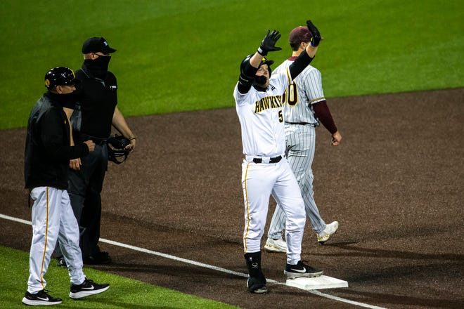 Iowa's Zeb Adreon (5) celebrates after hitting a triple during a NCAA Big Ten Conference baseball game against Minnesota, Friday, April 9, 2021, at Duane Banks Field in Iowa City, Iowa.