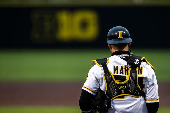 Iowa catcher Austin Martin (34) gets set behind home plate during a NCAA Big Ten Conference baseball game against Minnesota, Friday, April 9, 2021, at Duane Banks Field in Iowa City, Iowa.