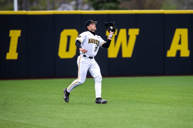 Iowa's Dylan Nedved (17) gets an out during a NCAA Big Ten Conference baseball game against Minnesota, Friday, April 9, 2021, at Duane Banks Field in Iowa City, Iowa.