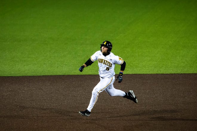 Iowa's Zeb Adreon (5) runs to third during a NCAA Big Ten Conference baseball game against Minnesota, Friday, April 9, 2021, at Duane Banks Field in Iowa City, Iowa.