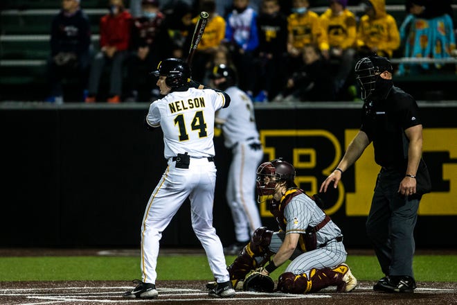 Iowa's Andy Nelson (14) bats during a NCAA Big Ten Conference baseball game against Minnesota, Friday, April 9, 2021, at Duane Banks Field in Iowa City, Iowa.