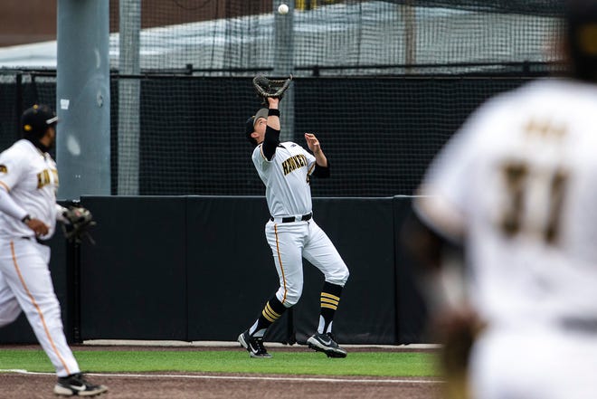 Iowa's Peyton Williams (45) gets an out during a NCAA Big Ten Conference baseball game against Minnesota, Friday, April 9, 2021, at Duane Banks Field in Iowa City, Iowa.