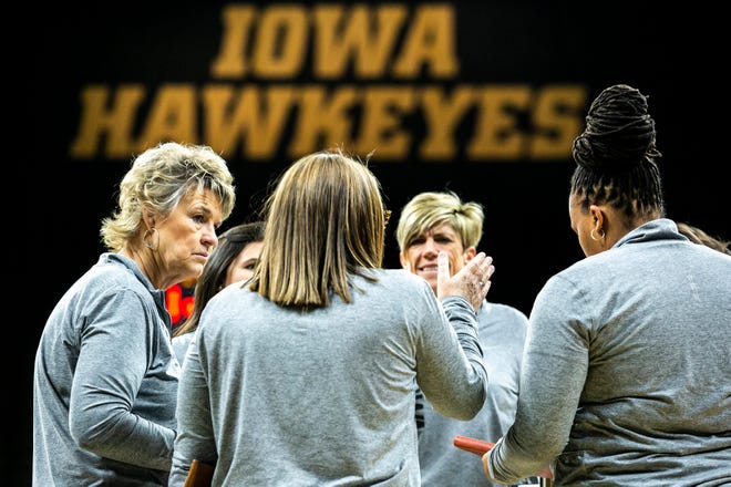 Iowa head coach Lisa Bluder, far left, talks with assistants during a NCAA non-conference women's basketball game against Samford, Thursday, Nov. 11, 2021, at Carver-Hawkeye Arena in Iowa City, Iowa.