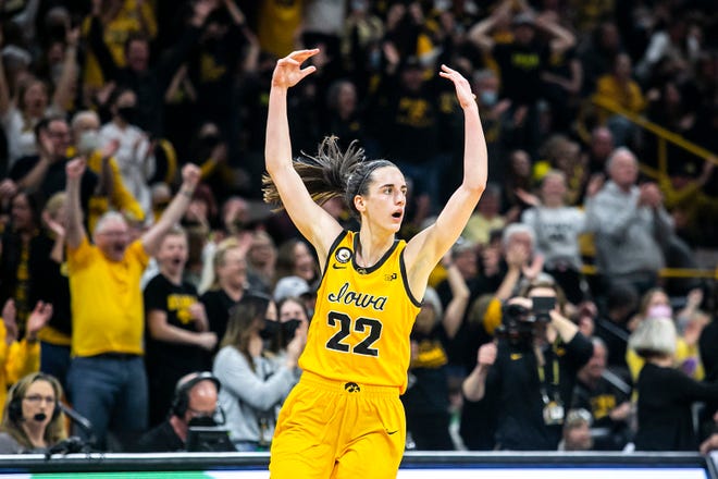 Iowa guard Caitlin Clark (22) reacts after making a 3-point basket during a NCAA Big Ten Conference women's basketball game against Michigan, Sunday, Feb. 27, 2022, at Carver-Hawkeye Arena in Iowa City, Iowa.