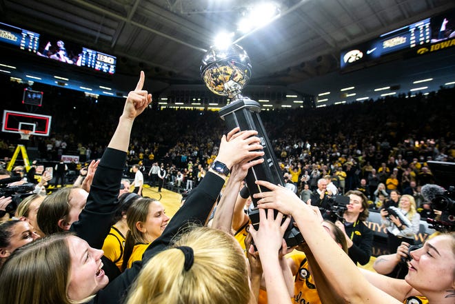 Iowa Hawkeyes players celebrate after a NCAA Big Ten Conference women's basketball game against Michigan, Sunday, Feb. 27, 2022, at Carver-Hawkeye Arena in Iowa City, Iowa.