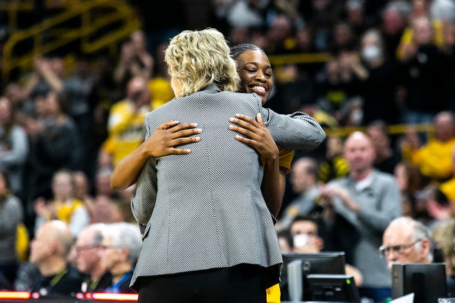 Iowa guard Tomi Taiwo, right, hugs head coach Lisa Bluder during a NCAA Big Ten Conference women's basketball game against Michigan, Sunday, Feb. 27, 2022, at Carver-Hawkeye Arena in Iowa City, Iowa.