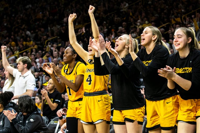 Iowa Hawkeyes players cheer during a NCAA Big Ten Conference women's basketball game against Michigan, Sunday, Feb. 27, 2022, at Carver-Hawkeye Arena in Iowa City, Iowa.