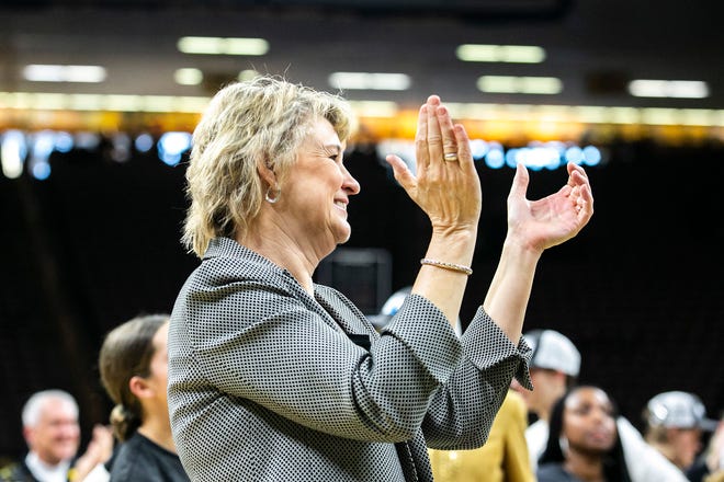Iowa head coach Lisa Bluder celebrates after a NCAA Big Ten Conference women's basketball game against Michigan, Sunday, Feb. 27, 2022, at Carver-Hawkeye Arena in Iowa City, Iowa.