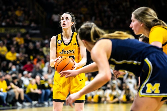 Iowa guard Caitlin Clark (22) makes a free throw during a NCAA Big Ten Conference women's basketball game against Michigan, Sunday, Feb. 27, 2022, at Carver-Hawkeye Arena in Iowa City, Iowa.