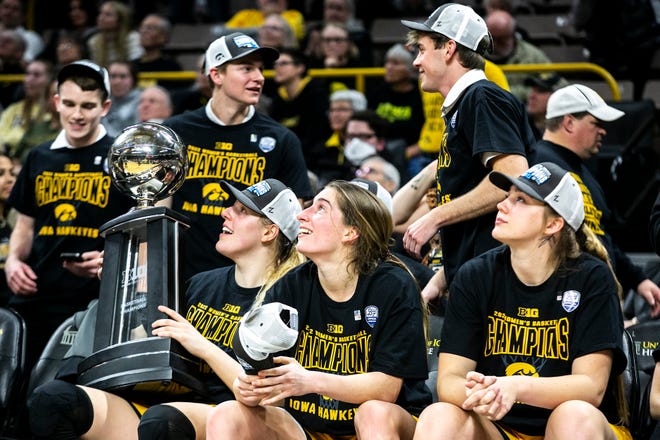 Iowa center Monika Czinano, left and guard Kate Martin smile while celebrating after a NCAA Big Ten Conference women's basketball game against Michigan, Sunday, Feb. 27, 2022, at Carver-Hawkeye Arena in Iowa City, Iowa.