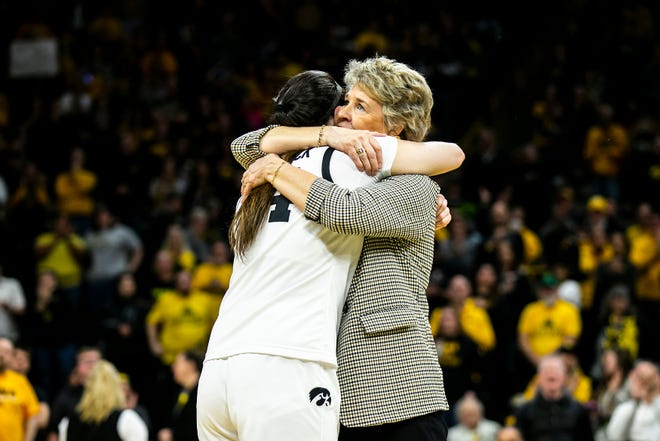 Iowa head coach Lisa Bluder embraces McKenna Warnock as she is acknowledged on senior day after a NCAA Big Ten Conference women's basketball game against Indiana, Sunday, Feb. 26, 2023, at Carver-Hawkeye Arena in Iowa City, Iowa.