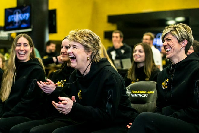 Iowa head coach Lisa Bluder, center, and Iowa associate head coach Jan Jensen react as Stanford is announced as the No. 1 seed during a NCAA women's basketball Selection Sunday watch party, Sunday, March 12, 2023, at Carver-Hawkeye Arena in Iowa City, Iowa.