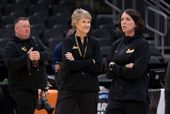 Iowa Hawkeyes head coach Lisa Bluder, center, watches practice at Climate Pledge Arena on Thursday, March 23, 2023 in Seattle.